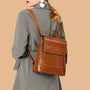 Sac à dos en cuir véritable brillant marron avec rabat, poignée et bretelles ajustables