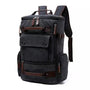 Sac à dos en toile noire avec plusieurs poches et accents en cuir marron pour homme casual
