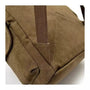 Zoom sur un sac en toile de coton marron avec sangle solide et couture visible