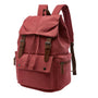 Sac à dos en toile bordeaux avec sangles et boucles en cuir marron, style casual homme