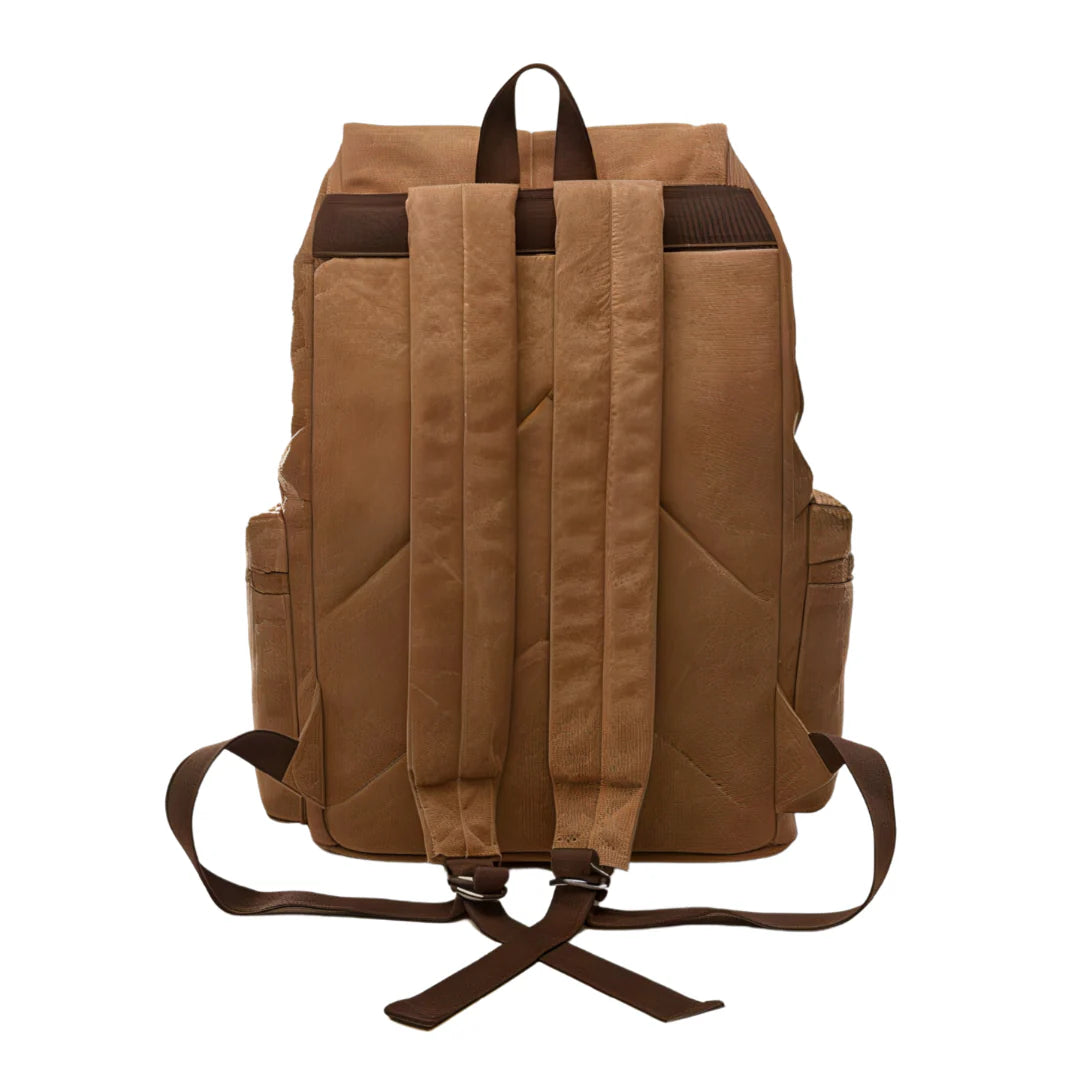 Sac à dos en toile cirée tan avec sangles en cuir marron foncé et anse supérieure
