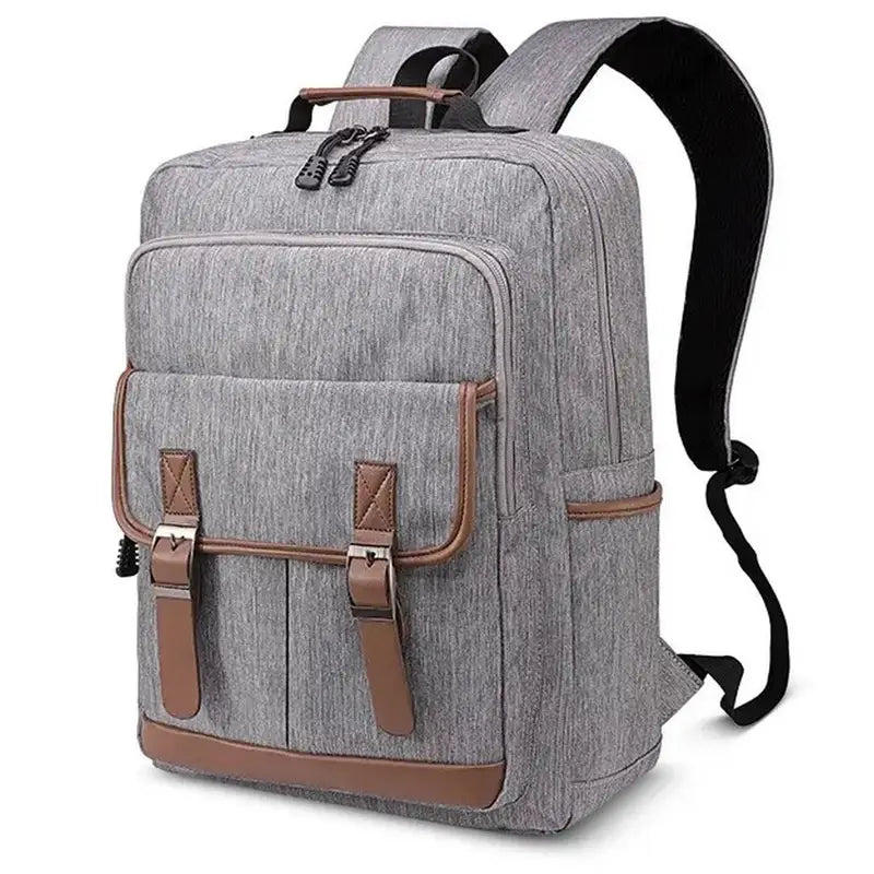 Sac à dos en tissu gris avec accents en faux cuir marron et poches à boucles pour femme