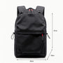 Sac à dos en nylon noir avec accents de fermeture éclair rouges et poches latérales à cordon pour ados et collégiens
