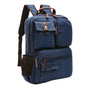 Sac à dos en toile bleu marine avec accents cuir marron et compartiments zippés