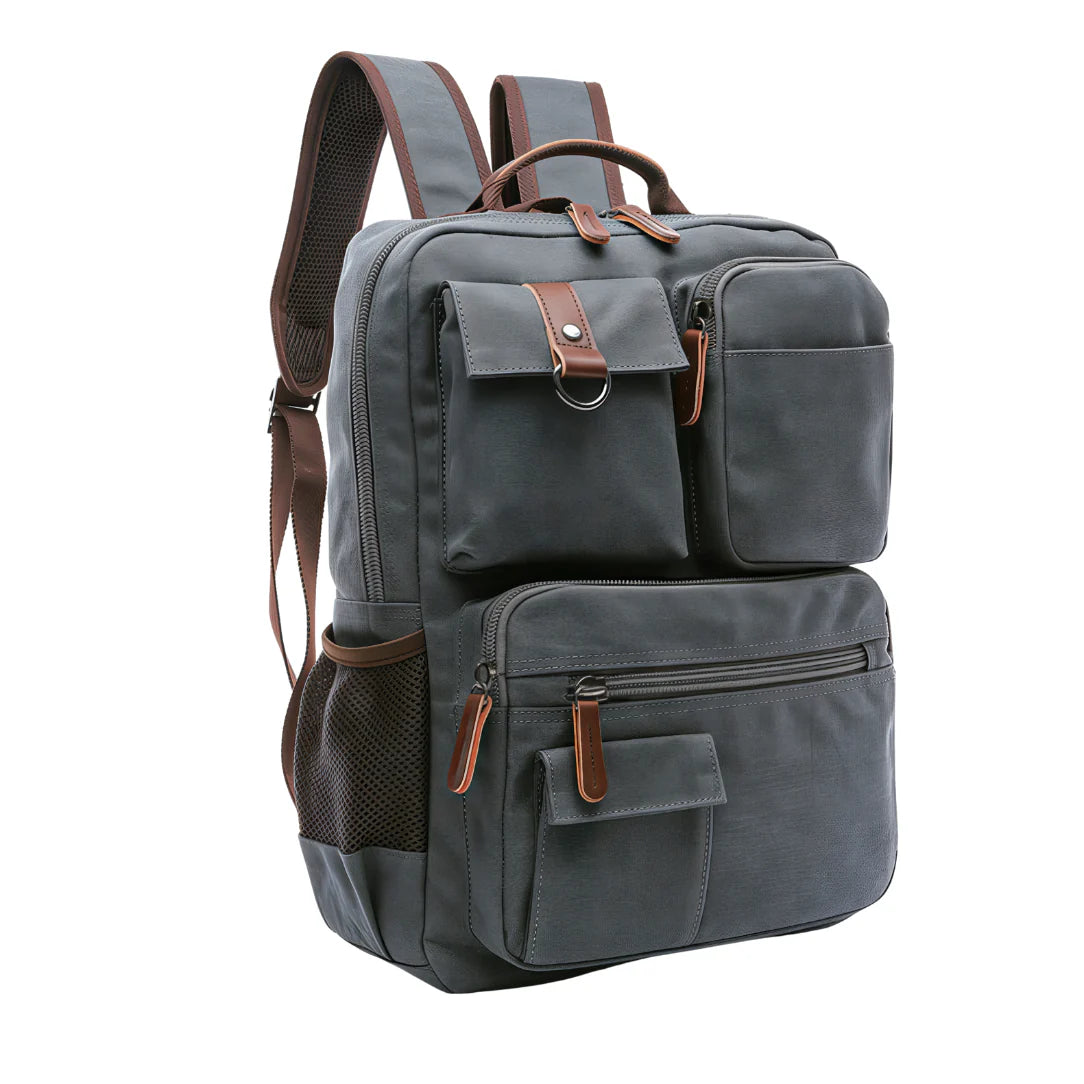 Sac à dos en toile gris foncé avec accents cuir marron et multiples compartiments zippés