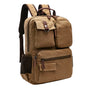 Sac à dos en toile beige avec accents cuir marron et multiples compartiments zippés