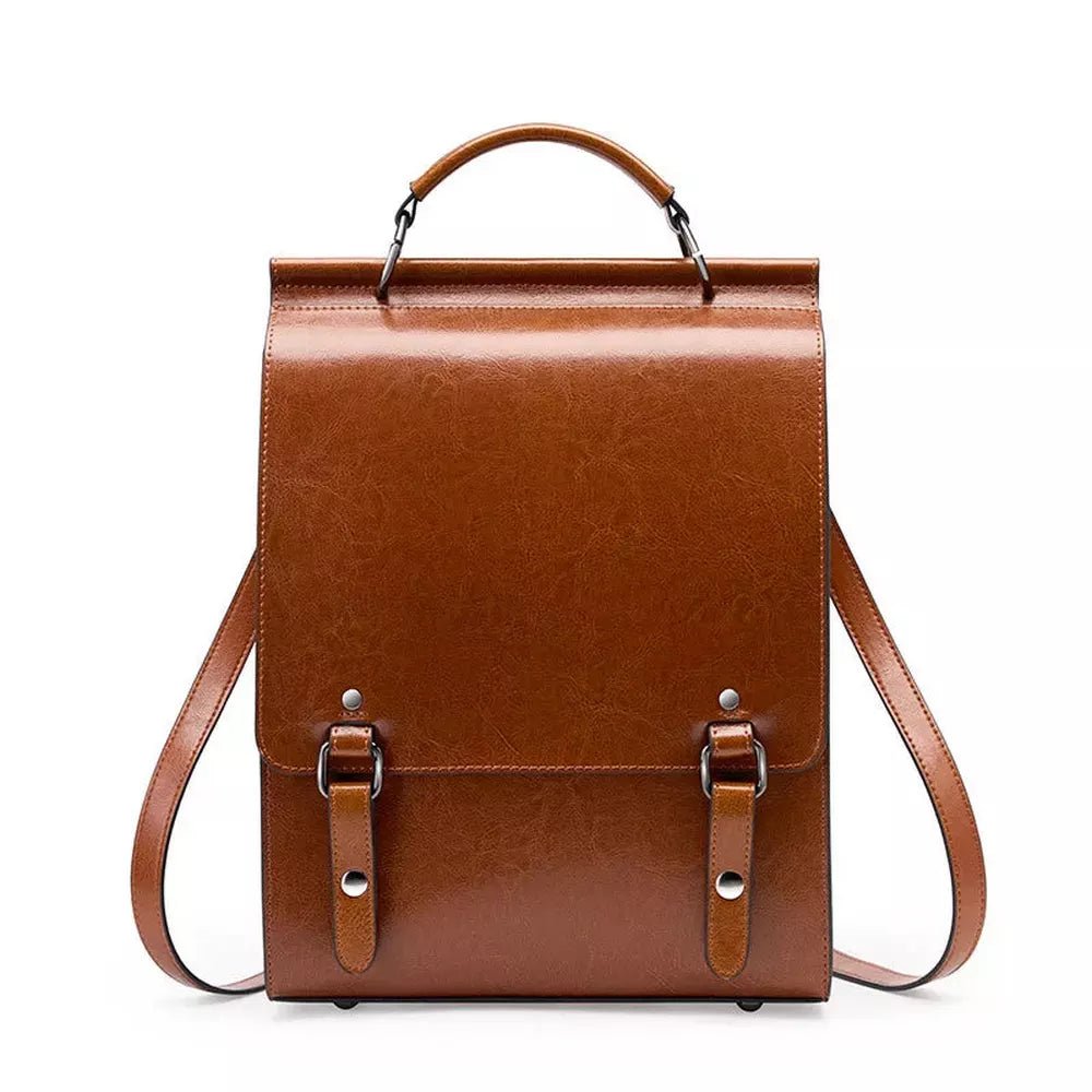 Sac à dos en cuir vintage marron avec poignée supérieure et boucles sur le rabat