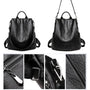 Sac à dos en cuir noir femme avec options de port multiples et hardware détaillé