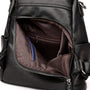 Sac à dos en cuir noir pour femme avec poche frontale zippée et pochette bleue intérieure