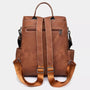 Sac à dos en cuir vintage brun avec bretelles ajustables et multiples poches zippées