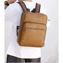 Sac à dos en cuir marron pour homme avec plusieurs compartiments zippés