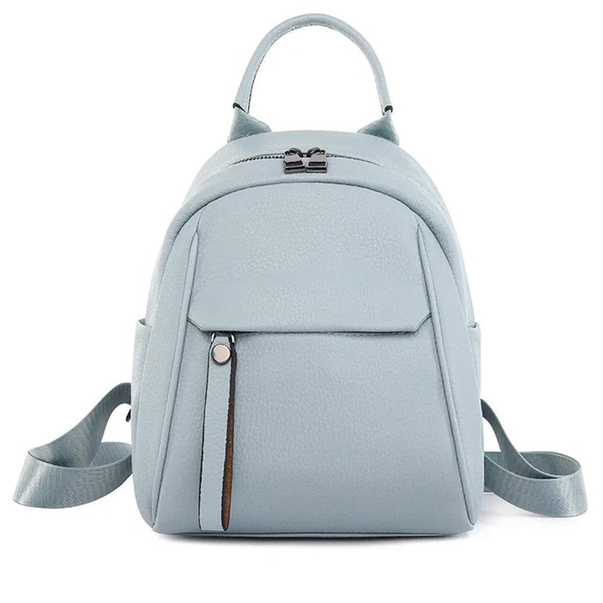 Petit sac à dos en cuir bleu clair avec poignée supérieure et bretelles ajustables