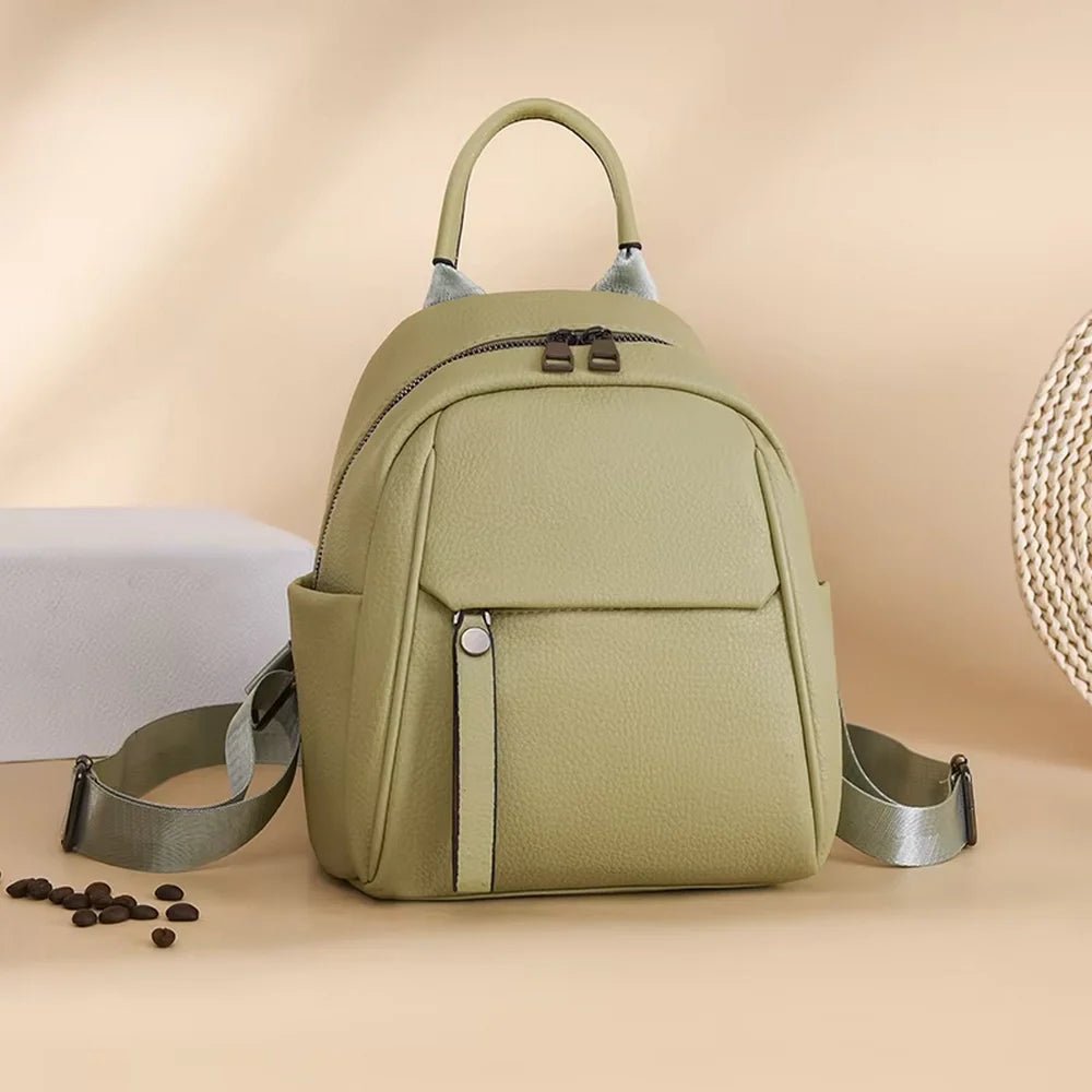 Sac à dos en cuir vert clair avec poignée supérieure et poches frontales