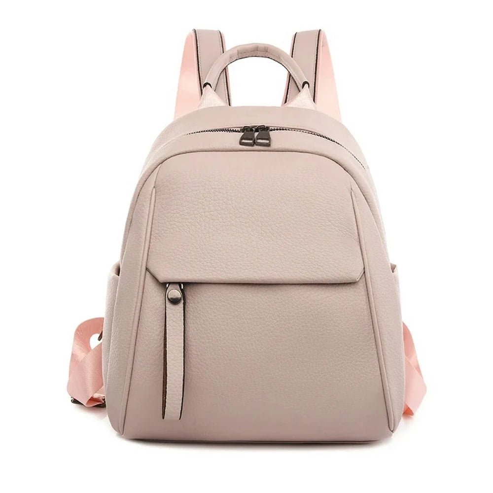 Sac à dos en cuir rose pâle avec poignée supérieure et deux bretelles ajustables