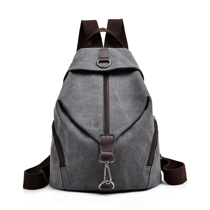 Sac à dos femme de ville en toile gris foncé avec bretelles marron et ferrures argentées