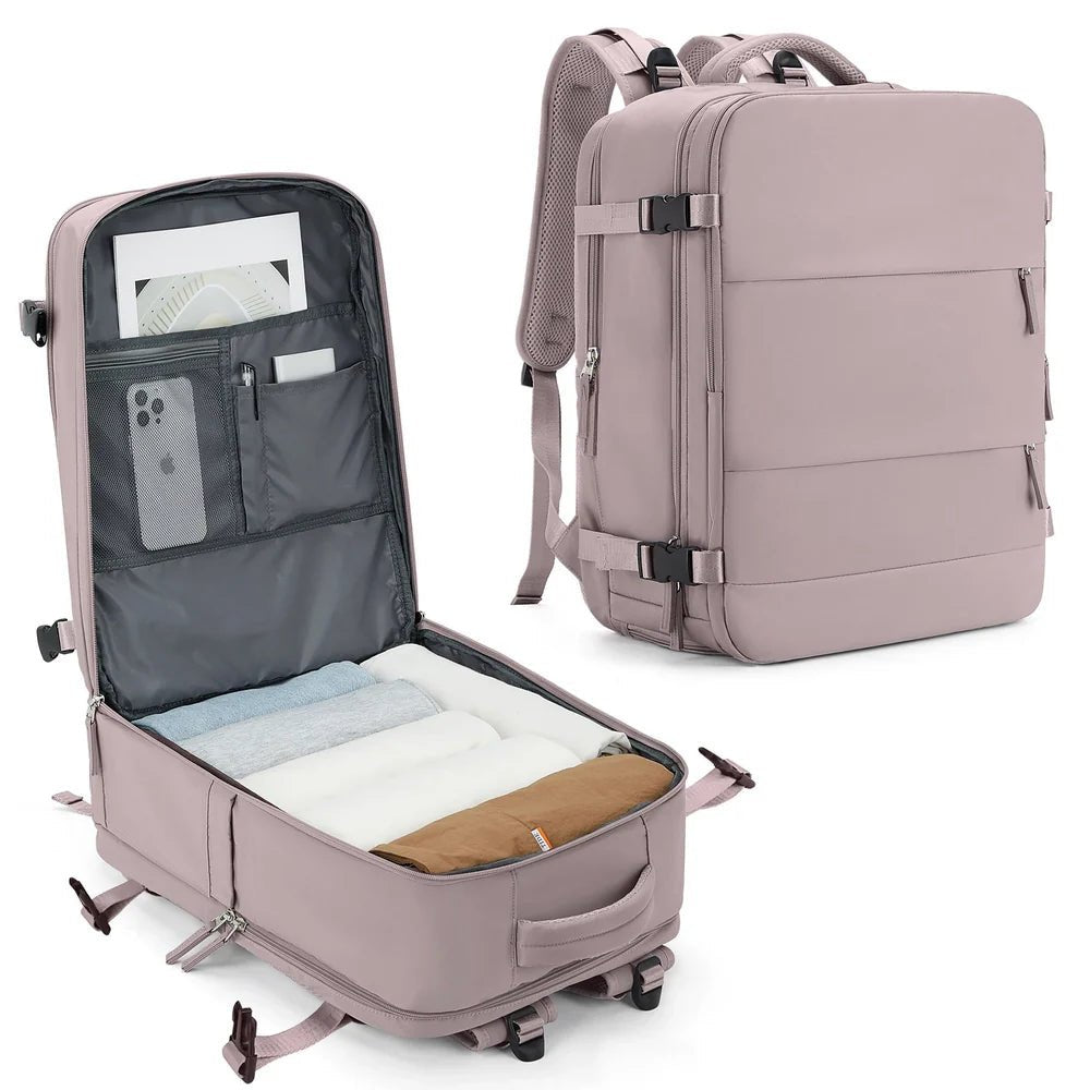 Sac de voyage rose ouvert et fermé avec plusieurs compartiments et roulettes
