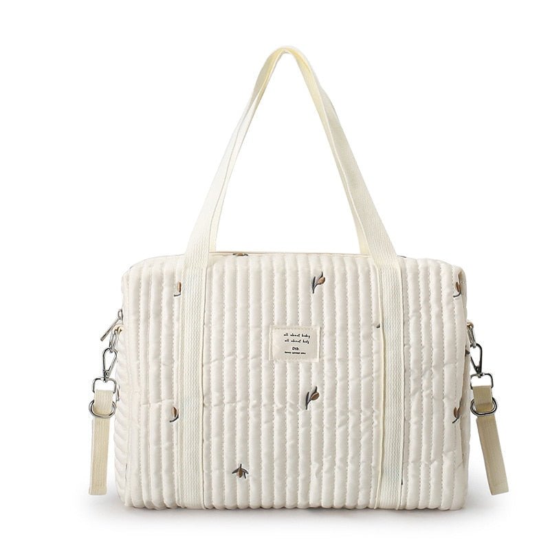 Sac à bandoulière en coton pour bébé avec motif brodé et poignée, style quilté