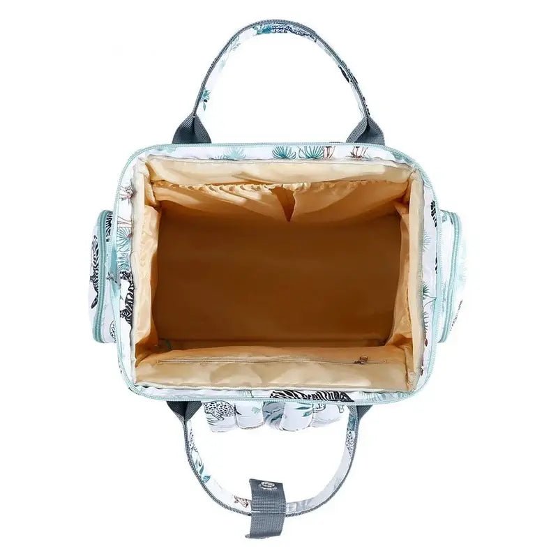 Sac à bandoulière à langer avec motif botanique et intérieur beige clair