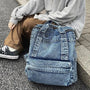 Sac à dos ado fille tendance en denim distressed avec poche frontale élégante