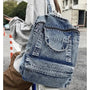 Sac à dos ado fille tendance en denim lavé avec poignées supérieures et poche zippée