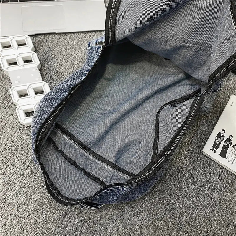 Sac à dos ado fille tendance en denim ouvert avec trim noir et poches intérieures