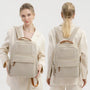 Sac à dos Amber en toile beige avec accents en cuir marron et bretelles réglables