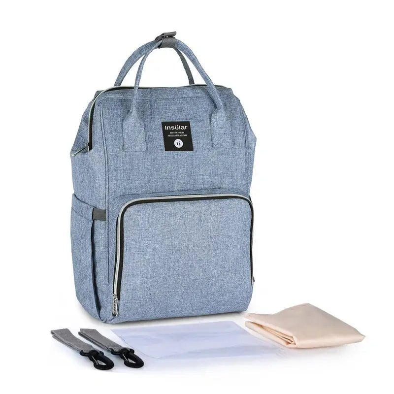 Sac à dos bébé à langer en tissu bleu clair avec plusieurs compartiments et options de port
