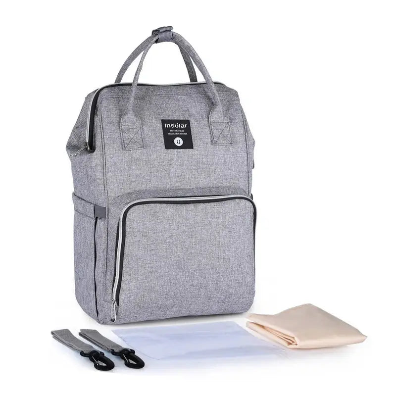 Sac à dos bébé à langer gris avec compartiments, poignées, bandoulières, tapis à langer