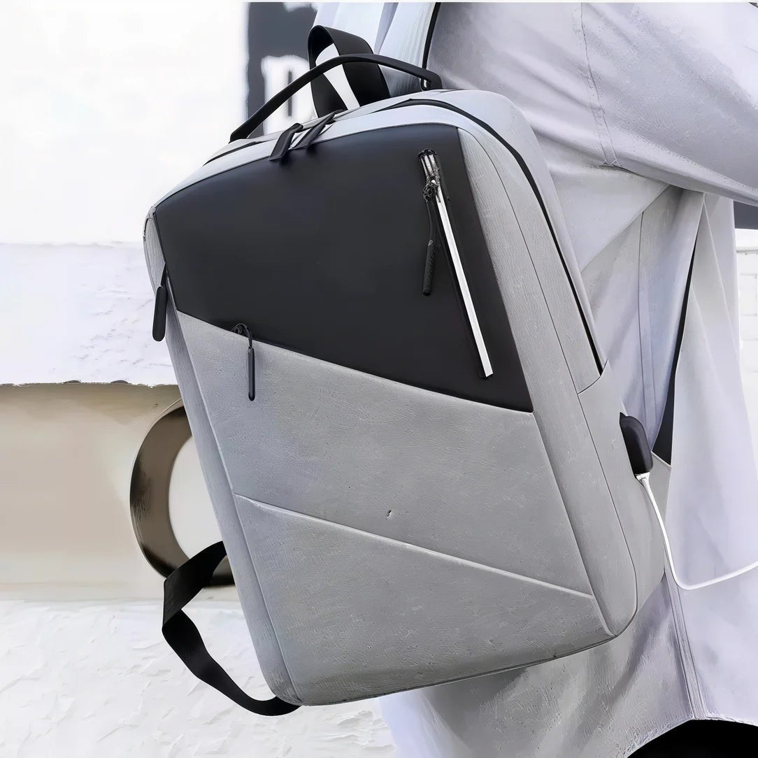Sac à dos bureau ordinateur gris et noir avec compartiments zippés et port USB externe