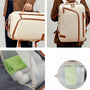 Sac à dos cabine Skyliner crème avec accents cuir marron et poches mesh