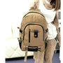 Sac à dos cartable homme en toile en canvas beige avec poches multiples et accents noirs