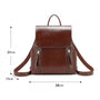 Sac à dos en cuir marron foncé brillant avec poignée supérieure et poches zippées