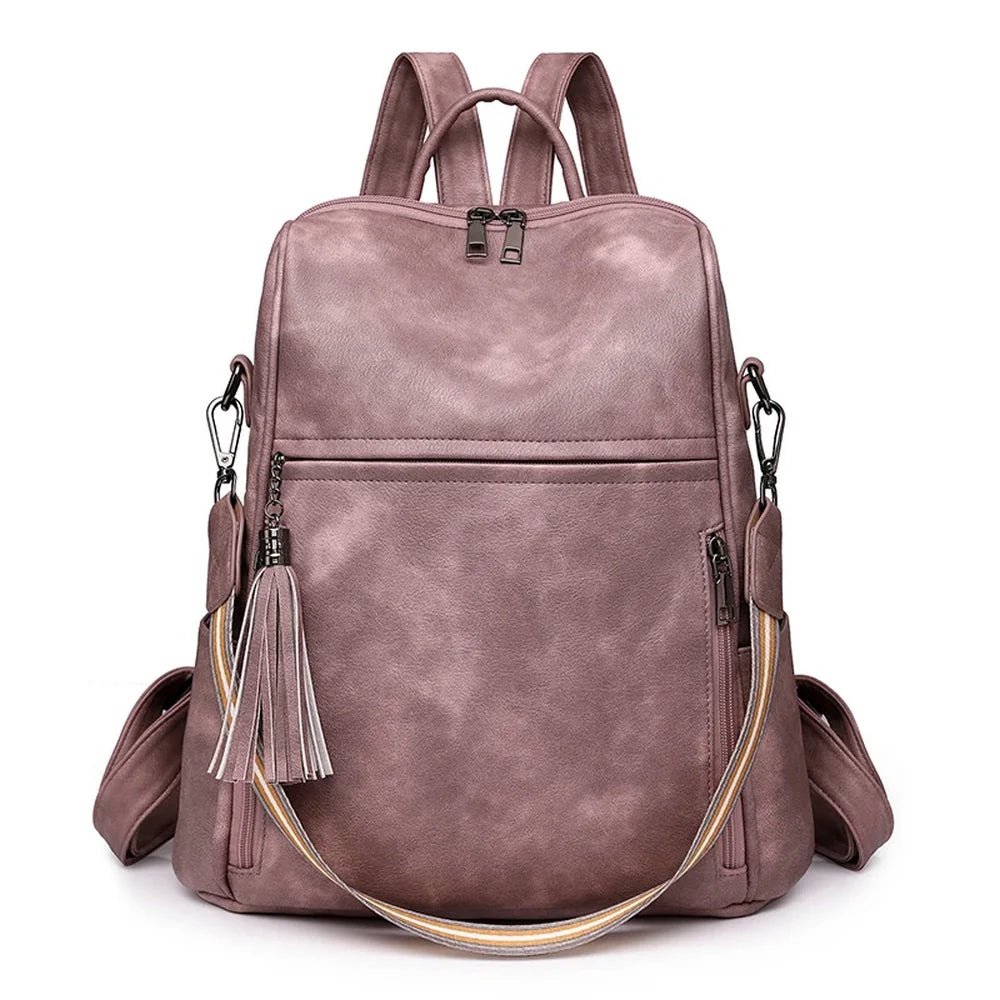 Sac à dos cuir souple violet en faux cuir avec poches extérieures et pompon doré