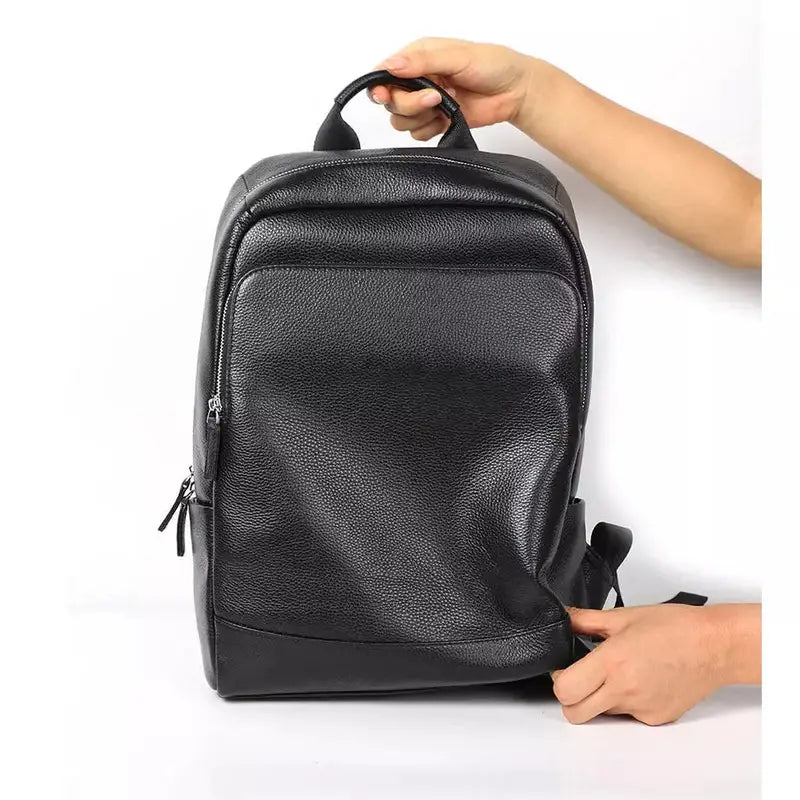 Sac à dos en cuir véritable pour homme avec poignée supérieure et poche zippée frontale