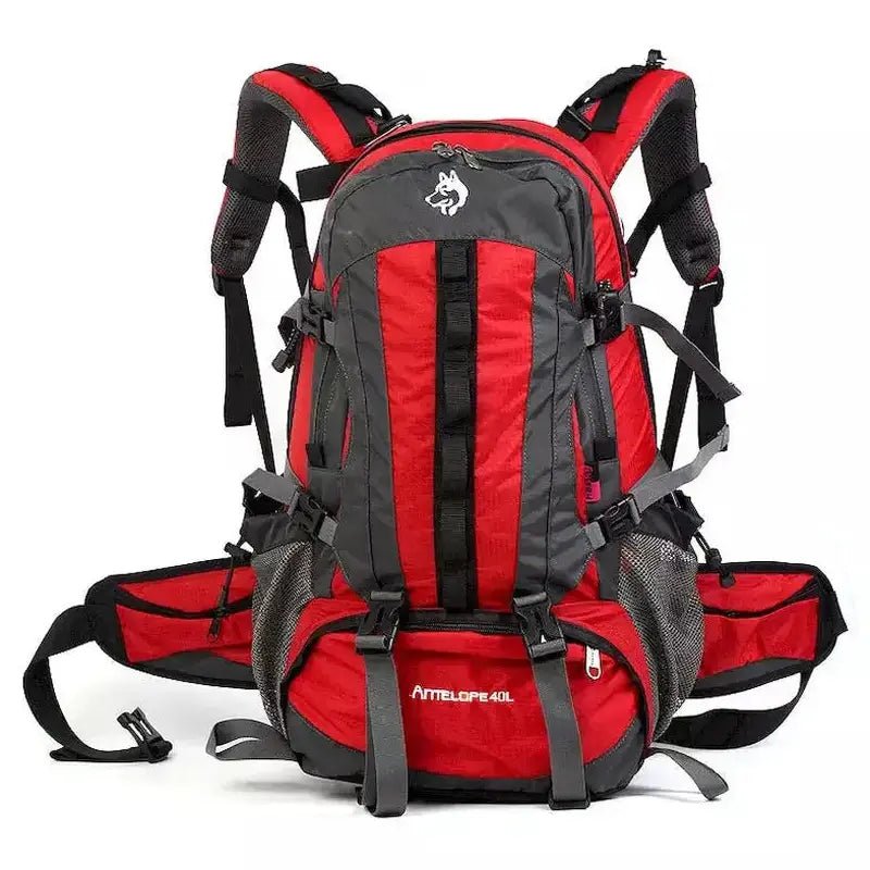 Sac à dos de randonnée 40L rouge et gris avec plusieurs compartiments et sangles