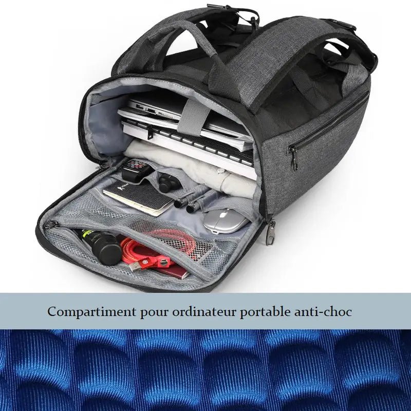 Sac à dos de travail gris ouvert avec plusieurs compartiments pour ordinateur