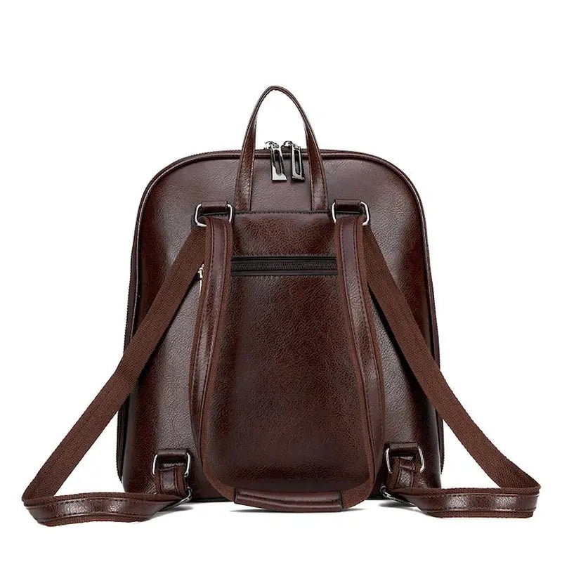 Sac à dos de ville femme en cuir marron foncé avec bretelles ajustables et poche zippée arrière