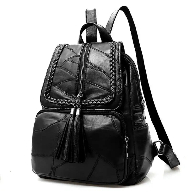 Sac à dos de ville en similicuir noir avec broderie tressée et zips à pompons