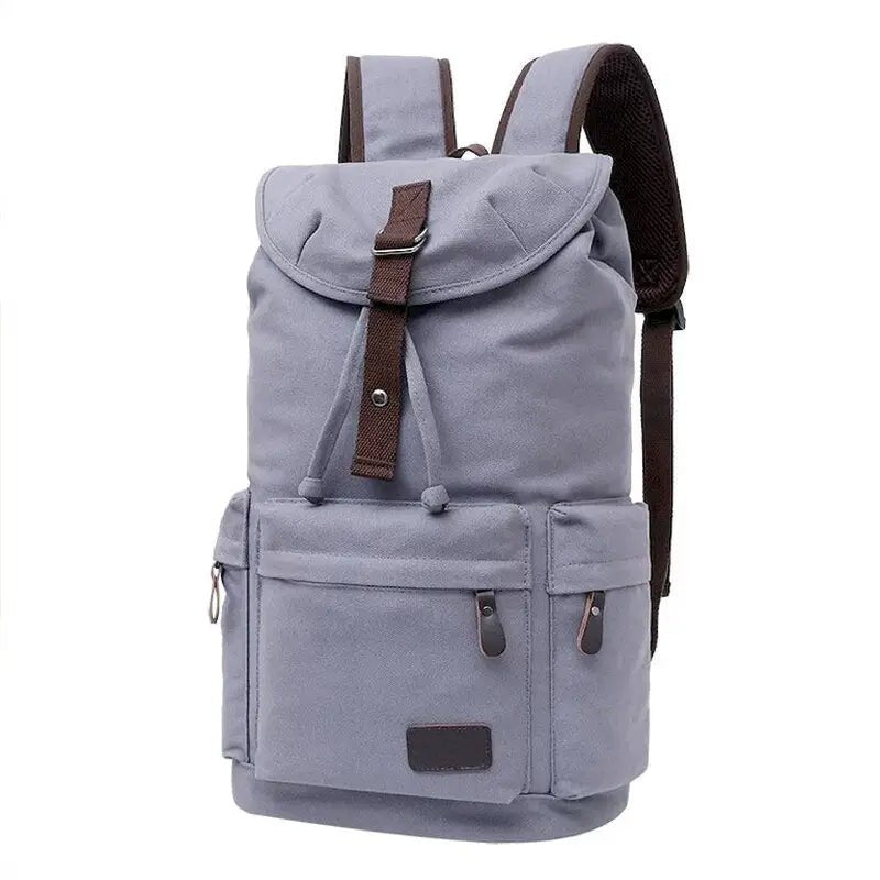 Sac à dos de voyage en toile bleu clair avec bretelles marron et poches extérieures