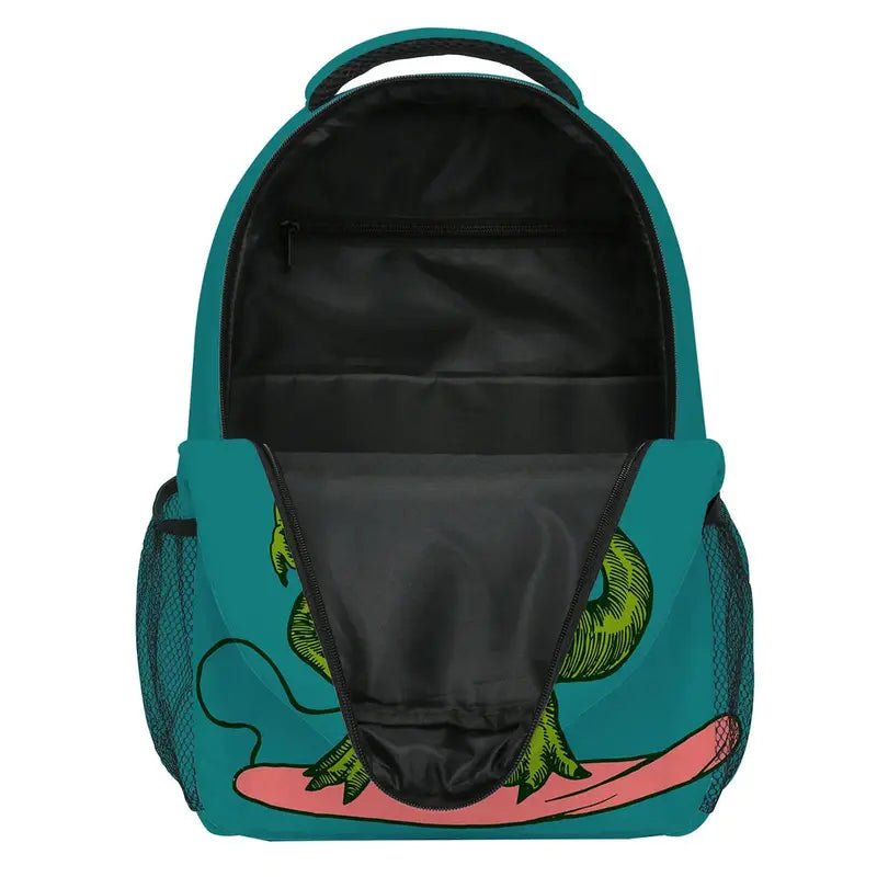 Sac à dos dinosaure maternelle ouvert avec un graphique de lézard vert sur une planche de surf rose
