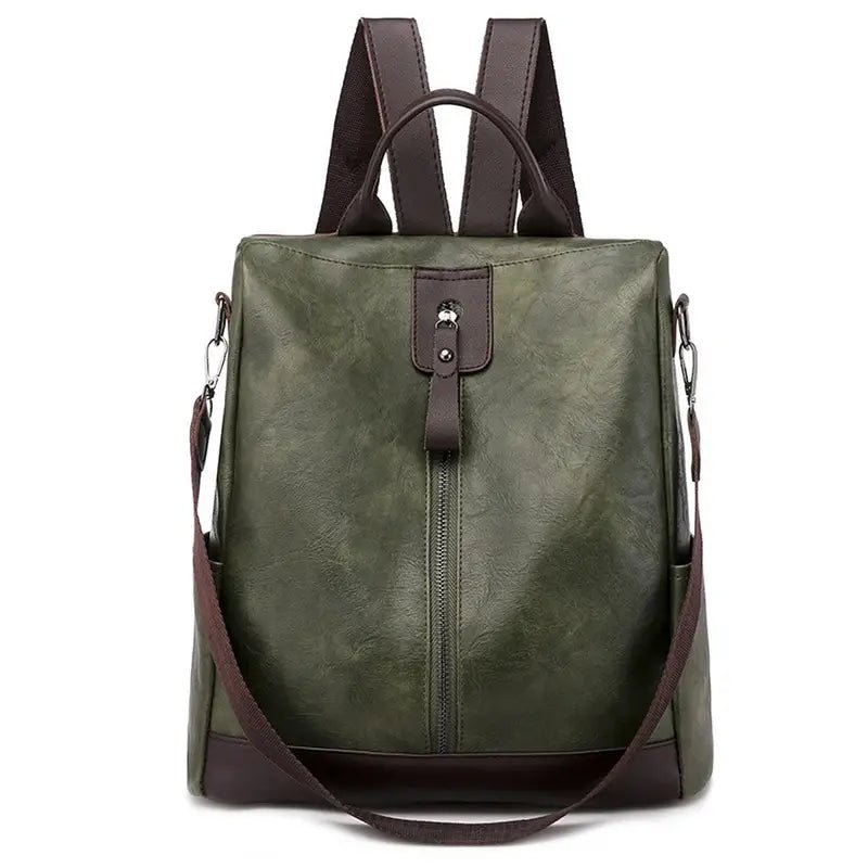 Sac à dos en cuir femme tendance en vert foncé avec bretelles marron et fermeture verticale