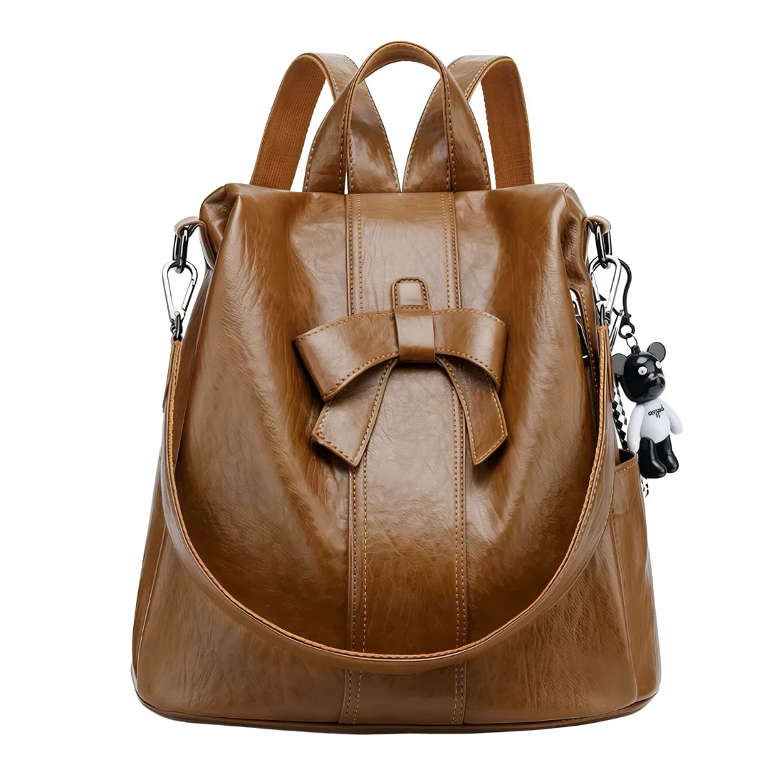 Sac à dos en cuir marron avec nœud papillon et charm ours noir et blanc