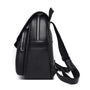 Sac à dos en cuir noir pour femme avec plusieurs compartiments zippés et bretelles ajustables
