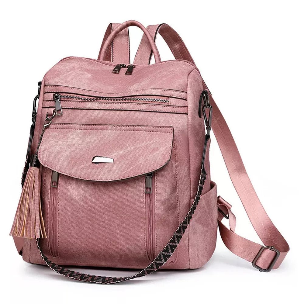 Sac à dos en cuir végétal rose avec plusieurs compartiments, tassel décoratif et bretelles ajustables