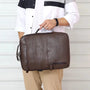 Sac à dos en simili cuir homme avec poignée, poche zippée et surface texturée