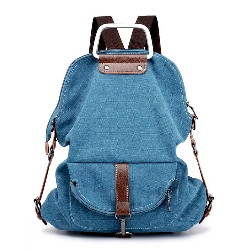 Sac à dos en tissu minimaliste bleu avec accents en cuir marron et poignée en métal argenté