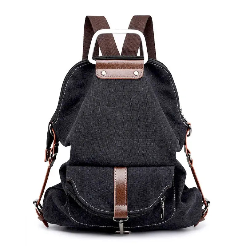 Sac à dos en tissu minimaliste noir avec accents en cuir marron et poche frontale