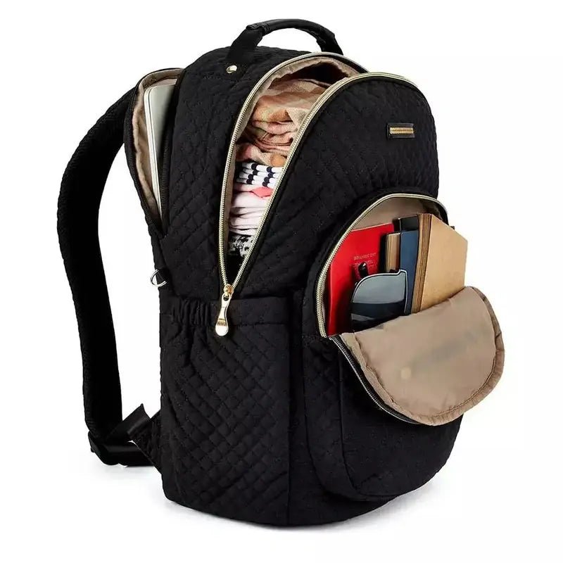 Sac à dos en tissus femme noir matelassé avec plusieurs compartiments ouverts