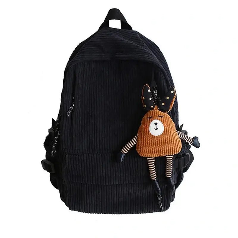 Sac à dos en velours noir avec un porte-clés peluche d’ours brun