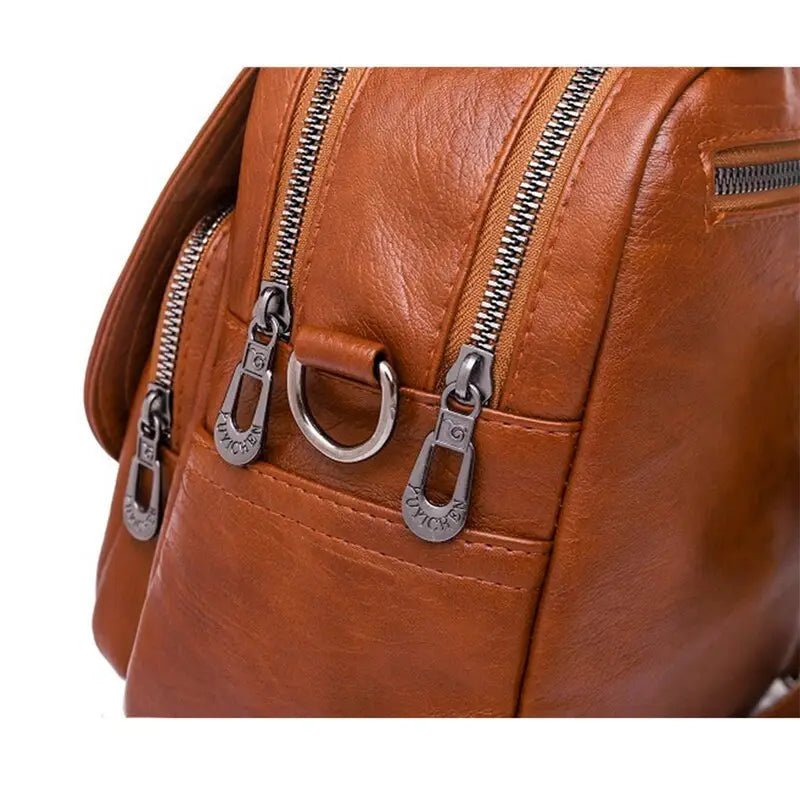 Sac à dos femme en cuir chic avec sac en cuir marron, zips et ferrures métalliques